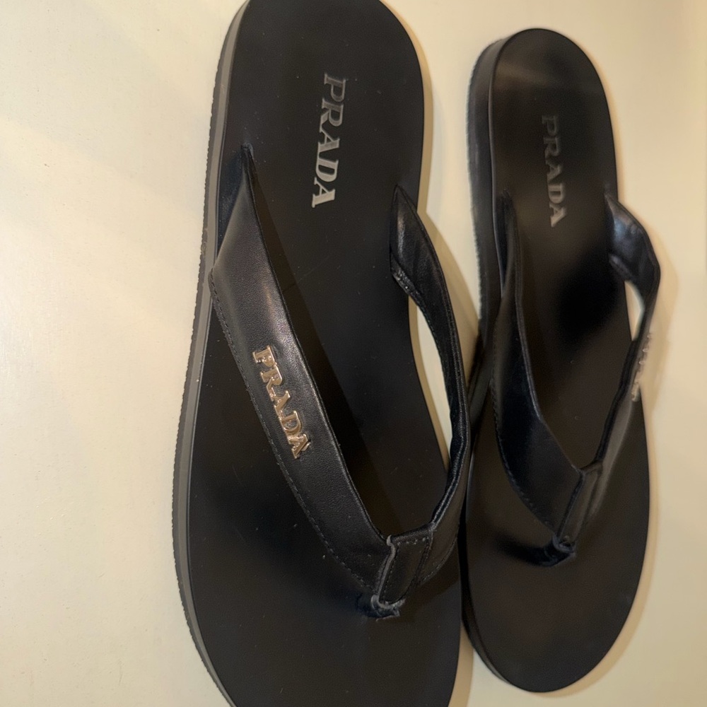 Prada Black Leather Flip Flops with Gold Logo